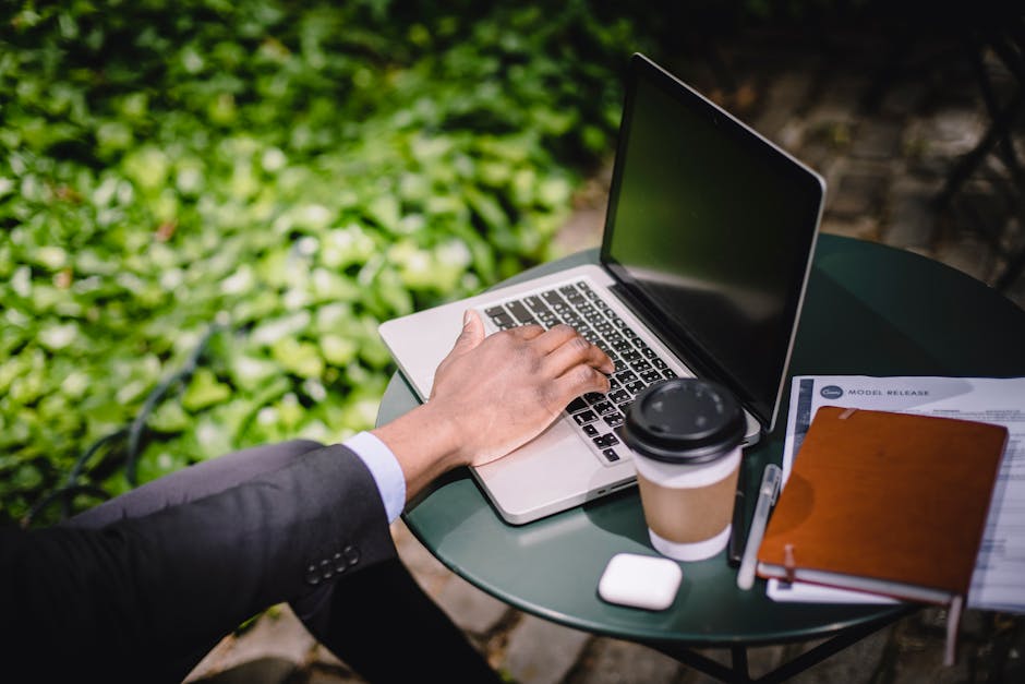 person-typing-laptop-coffee